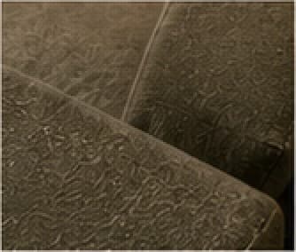 Close view of the textured olive Soft Weave upholstery.