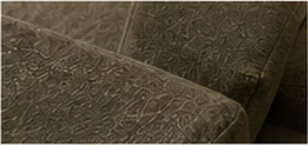 Close view of the meeting point between two upholstered panels.